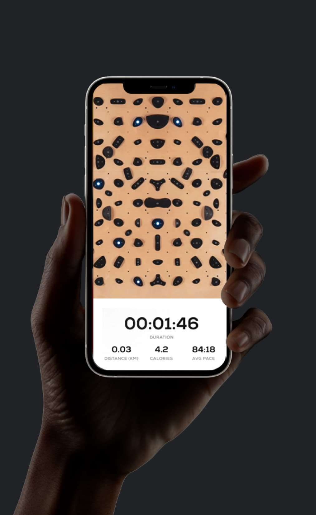 The timer held in one hand at the wall